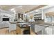 Modern eat-in kitchen with custom cabinetry and stainless steel appliances at 1018 W Kaler Dr, Phoenix, AZ 85021