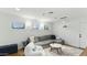 Cozy living room with a large gray sectional, shag rug, and natural light from the windows at 1018 W Kaler Dr, Phoenix, AZ 85021