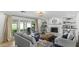 Bright living room featuring built-in shelves, fireplace, and sliding doors at 1018 W Kaler Dr, Phoenix, AZ 85021
