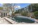 Inviting backyard pool and spa area with mature trees and a quaint pool house, perfect for outdoor entertaining at 1018 W Kaler Dr, Phoenix, AZ 85021