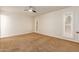 Bedroom with carpet flooring and plantation shutters at 10405 W Sombrero Cir, Sun City, AZ 85373