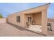 Relax on the covered patio of this home, featuring neutral tones, gravel landscaping, and easy access from the backyard at 10545 W Mission Dr, Arizona City, AZ 85123