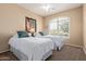 Bedroom featuring two twin beds, neutral walls, ceiling fan, and a well-lit window at 10960 E Monte Ave # 199, Mesa, AZ 85209