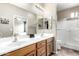 Bathroom featuring double sinks and access to shower and bedroom at 10960 E Monte Ave # 257, Mesa, AZ 85209