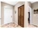 Welcoming foyer with neutral paint, tiled floor, closet, and arched doorway at 10960 E Monte Ave # 257, Mesa, AZ 85209