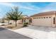 Attractive single-Gathering home with a tidy desert landscape, a spacious driveway, and a neutral-colored exterior at 10960 E Monte Ave # 257, Mesa, AZ 85209