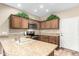 Well-lit kitchen with wood cabinets, stainless steel appliances, and ample counter space, perfect for cooking at 10960 E Monte Ave # 257, Mesa, AZ 85209