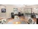 Comfortable living room with hardwood floors, ceiling fan, and sliding door access to the backyard at 10960 E Monte Ave # 257, Mesa, AZ 85209