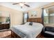 Comfortable main bedroom with natural light, ceiling fan and ensuite bathroom at 10960 E Monte Ave # 257, Mesa, AZ 85209
