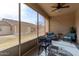 Inviting screened patio with furniture overlooking the backyard at 10960 E Monte Ave # 257, Mesa, AZ 85209