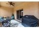 Charming patio with dining set, ceiling fan, and grill, perfect for outdoor entertaining at 10960 E Monte Ave # 257, Mesa, AZ 85209