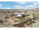Custom desert home boasts desert landscaping and a fenced in yard with a sparkling pool at 11097 Quinn Dr, Goodyear, AZ 85338