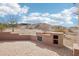 Backyard patio features a built-in outdoor kitchen and mountain views at 11097 Quinn Dr, Goodyear, AZ 85338
