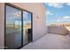 Balcony with sliding glass doors and mountain views at 11097 Quinn Dr, Goodyear, AZ 85338