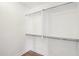 Walk-in closet with built-in shelving and rods at 11097 Quinn Dr, Goodyear, AZ 85338