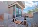 Charming courtyard featuring artistic decor, flagstone, desert landscaping and a decorative stone bridge at 11097 Quinn Dr, Goodyear, AZ 85338