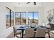 Cozy dining area with a modern table setting, large windows with scenic desert views, and stylish accents at 11097 Quinn Dr, Goodyear, AZ 85338