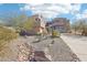Stunning contemporary home showcasing desert landscaping, a circular driveway and modern architectural design at 11097 Quinn Dr, Goodyear, AZ 85338