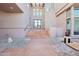 Grand entrance featuring stone steps, modern black door, desert landscaping, and natural light creating a welcoming arrival at 11097 Quinn Dr, Goodyear, AZ 85338