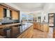 Bright kitchen featuring stainless steel appliances, wood cabinets, tile backsplash and spacious countertops at 11097 Quinn Dr, Goodyear, AZ 85338