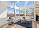 Bright living room with stylish furnishings and large windows offering stunning views of the surrounding landscape at 11097 Quinn Dr, Goodyear, AZ 85338