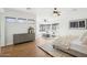 Bright main bedroom with wood floors, a ceiling fan and a sitting area at 11097 Quinn Dr, Goodyear, AZ 85338