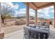 Covered patio features mountain views and outdoor seating at 11097 Quinn Dr, Goodyear, AZ 85338