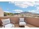 Relaxing patio with comfortable seating and mountain views at 11097 Quinn Dr, Goodyear, AZ 85338