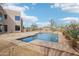 Gorgeous pool area surrounded by stone and desert plants at 11097 Quinn Dr, Goodyear, AZ 85338
