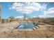 Beautiful pool with waterfall features and desert landscaping, ideal for relaxing and entertaining outdoors at 11097 Quinn Dr, Goodyear, AZ 85338