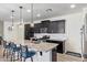 Kitchen showcasing stainless steel appliances, granite countertops, and a view of the entry door at 11558 W Levi Dr, Avondale, AZ 85323