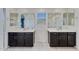 Bathroom featuring double vanities with modern dark brown cabinets and a tiled floor at 12018 W Taylor St, Avondale, AZ 85323