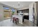 Well-equipped kitchen with stainless steel appliances and a breakfast bar overlooking the backyard at 12018 W Taylor St, Avondale, AZ 85323