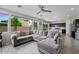 Open-concept living space with a large sectional sofa and access to the kitchen at 12018 W Taylor St, Avondale, AZ 85323