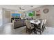 Spacious living room with dining area featuring tile flooring and an abundance of natural light at 12018 W Taylor St, Avondale, AZ 85323