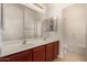 Bright bathroom featuring a double vanity and a separate shower and toilet area at 12221 W Locust Ln, Avondale, AZ 85323