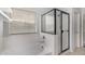Modern bathroom featuring a soaking tub and separate glass-enclosed shower at 12221 W Locust Ln, Avondale, AZ 85323