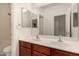 Bathroom featuring a double vanity with framed mirror and tub/shower combo at 12221 W Locust Ln, Avondale, AZ 85323