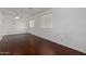Bright and airy bonus room with wood-look floors, neutral walls, and natural light at 12221 W Locust Ln, Avondale, AZ 85323