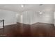 Spacious bonus room with wood-look floors, ceiling fans and built-in storage at 12221 W Locust Ln, Avondale, AZ 85323