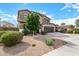 Lovely two-story home featuring a well-manicured yard with a two-car garage at 12221 W Locust Ln, Avondale, AZ 85323