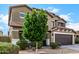 Beautiful two-story home featuring a well-manicured yard and attached two-car garage at 12221 W Locust Ln, Avondale, AZ 85323