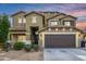 Charming two-story home with a two-car garage and beautiful sunset at 12221 W Locust Ln, Avondale, AZ 85323