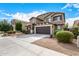 Beautiful two-story home features a well-manicured front yard and a two-car garage at 12221 W Locust Ln, Avondale, AZ 85323