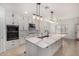 Modern kitchen with white cabinets, granite countertops, and stainless steel appliances at 12221 W Locust Ln, Avondale, AZ 85323