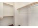 Walk-in closet with built-in shelving and hanging rods at 12221 W Locust Ln, Avondale, AZ 85323