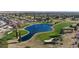 Golf course view with a scenic pond and lush green fairways at 13202 W Flagstone Ct, Sun City West, AZ 85375