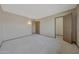 Bedroom featuring neutral walls and carpet; adjacent doorways at 13202 W Flagstone Ct, Sun City West, AZ 85375