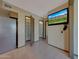 Bonus room featuring two storage closets, a TV, and a stainless steel refrigerator at 13202 W Flagstone Ct, Sun City West, AZ 85375