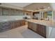 Kitchen featuring granite countertops, custom cabinets and stainless steel appliances at 13202 W Flagstone Ct, Sun City West, AZ 85375